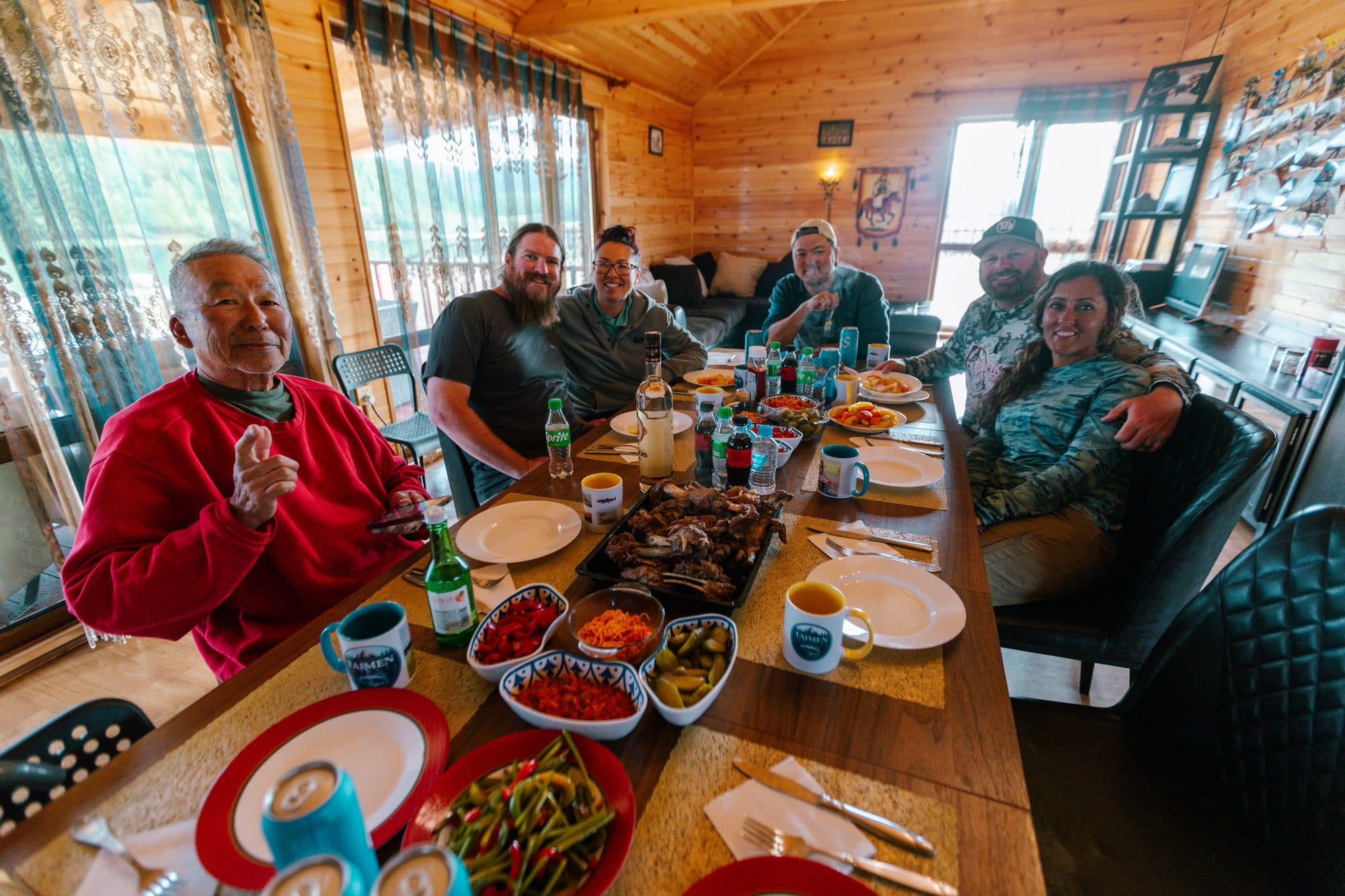 Group dinner at the long table inside the expedition lodge