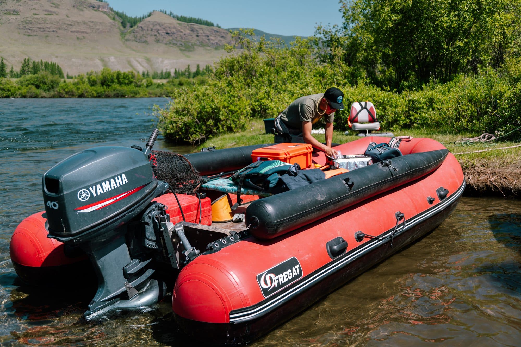 Support rafts on the river with Mongolian mountains behind