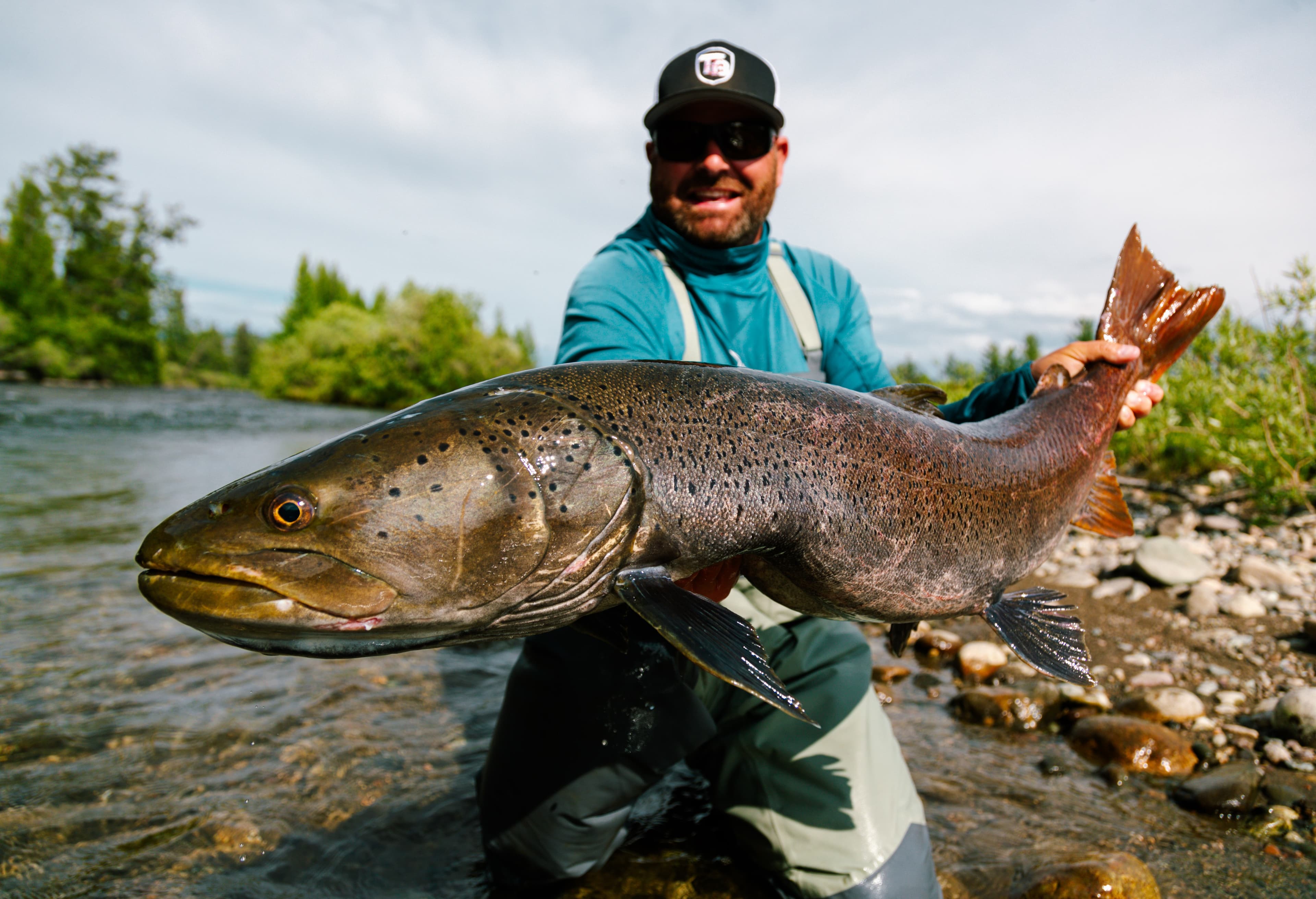 Angler holding a giant taimen on the Mongolia expedition